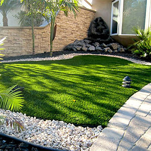 Use Artificial Grass And Pebbles