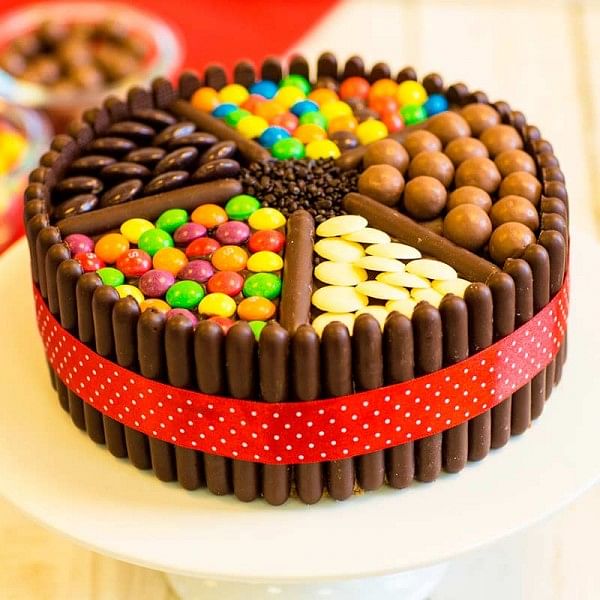One Kg Chocolate Cream Cake Decorated with Kitkat, Gems, and chocolate candies