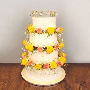 7 Kg 4 Tier Vanilla Cake decorated with 50 (pink and yellow roses)