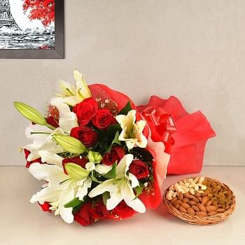 12 Red Roses in Paper packing with 4 White Oriental Lilies and 250 gm Assorted DryFruits(Almond,Cashew nut,Raisins)