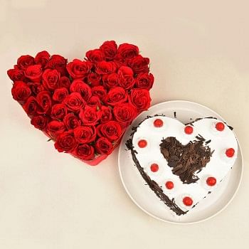 Heart Shaped Arrangement of 30 Red Roses with 1 Kg Heart Shape Black Forest Cake