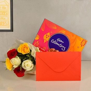  6 Assorted Roses wrapped in White paper with a box of Cadbury's Celebrations (125.3 gms) and 1 Greeting Card