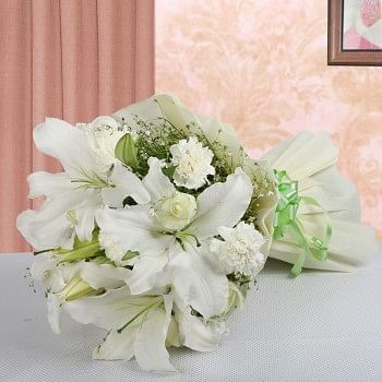 8 White Carnations with 8 White Roses and 4 White Asiatic Lilies in Paper Packing