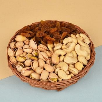 A Cane Basket containing Pistachios (100 gms), Raisins (100 gms) and Cashew Nuts (100 gms)