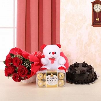 6 Red Roses in Red Paper, Red Bow with Truffle Cake (Half Kg), 1 Teddy Bear (6inches) and Ferrero Rocher (16pcs)
