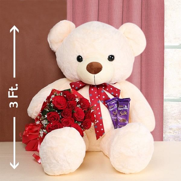 12 Red Roses in Red Paper with 2 Cadbury Silk Chocolates 60gms and Teddy Bear 3ft.