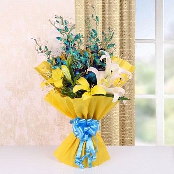 4 Blue Orchids and 4 Yellow and Pink Asiatic Lilies in Yellow Paper