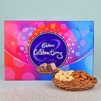A Cane Basket containing Almonds (100 gms) and Cashew Nuts (100 gms) and 1 Cadbury Celebrations Pack (114 gms)