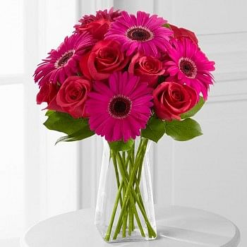 A Bunch of 10 Red Roses and 6 Pink Gerberas in a Glass Vase