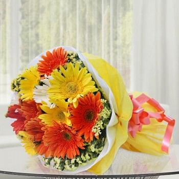 12 Assorted (Orange,Yellow,White) Gerberas wrapped in special Paper
