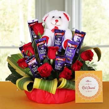 8 Red Roses with 8 Cadbury's DairyMilk Chocolates (14gms each) and Teddy Bear (6 inches) and One Pack of Roli Chawal in a Basket
