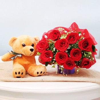 10 red roses in Paper Packing with 6 inches teddy