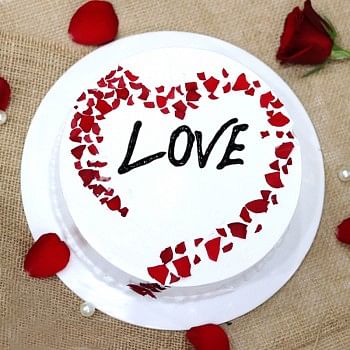 Half Designer Vanilla Cream Cake Decorated with Rose Petals in Heart Shape
