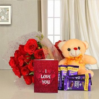12 Red Roses in Cellophane Packing with 5 Cadbury's DairyMilk Chocolates (13.2 gms each) and 1 Teddy Bear (6 inches) along with Valentines Day Greeting Card
