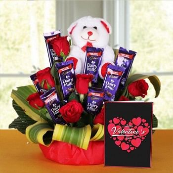 8 Red Roses with 8 Cadbury's DairyMilk Chocolates (14gms each) and Teddy Bear (6 inches) and Valentines Day Greeting Card in a Basket