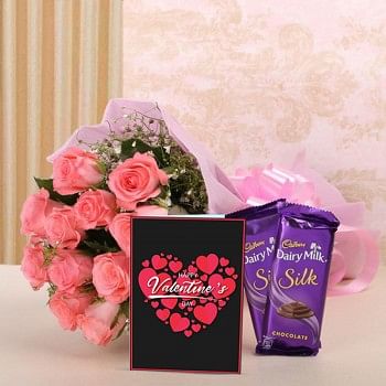 12 Pink Roses in Pink Paper with 2 Cadbury's Silk (60 gms each) and Greeting Card Valentines Day