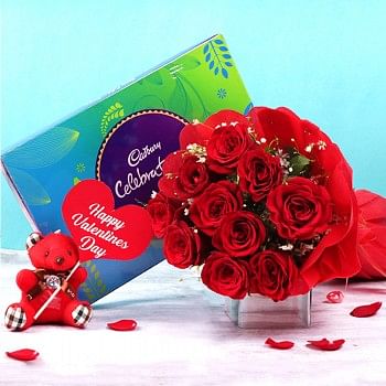 10 Red Roses in Paper Packing with One Cadbury Celebration Box (141.4 gm) and One Teddy Bear (3 inches) with "Happy Valentines Day" Tag