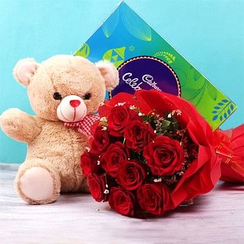 10 red roses in Paper Packing with One Cadbury Celebration Pack (141.4 gm) and 12 inches Teddy Bear