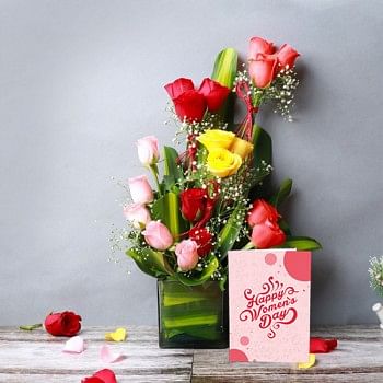 Arrangement of 18 Mixed Roses (Red,Light Pink,Yellow) in Glass Vase with leaves and Womens Day Greeting Card