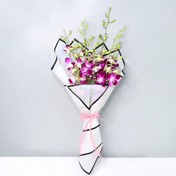 7 Purple Orchids wrapped in special Paper