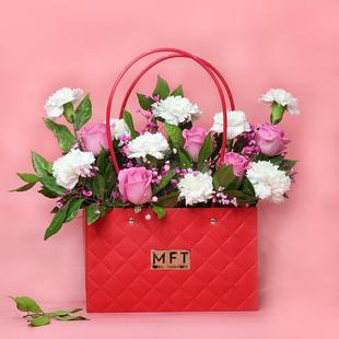 White Carnation and Pink Roses in Red Handbag