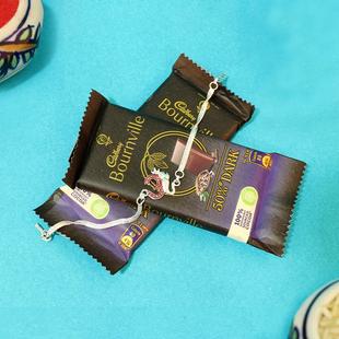 Exquisite Silver OM Rakhi with Chocolates