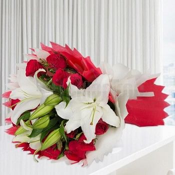 12 Red Roses and 3 White Asiatic Lilies wrapped in Red and White special paper