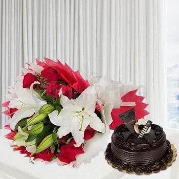 12 Red Roses and 3 White Asiatic Lilies wrapped in crape paper with Half Kg Chocolate Truffle Cake