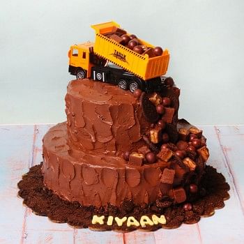 3 kg 3 Tier Chocolate Cream Cake Topped with Snicker,Cadbury Dairy Milk Shots and Oreo Biscuits with a Toy Truck